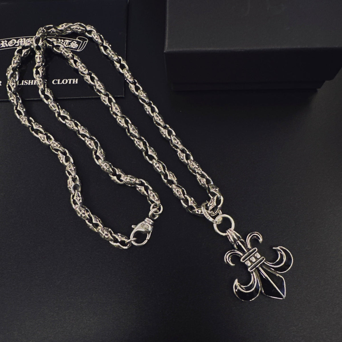 Martin Graham pendant necklace in polished metal-tone – close-up detail