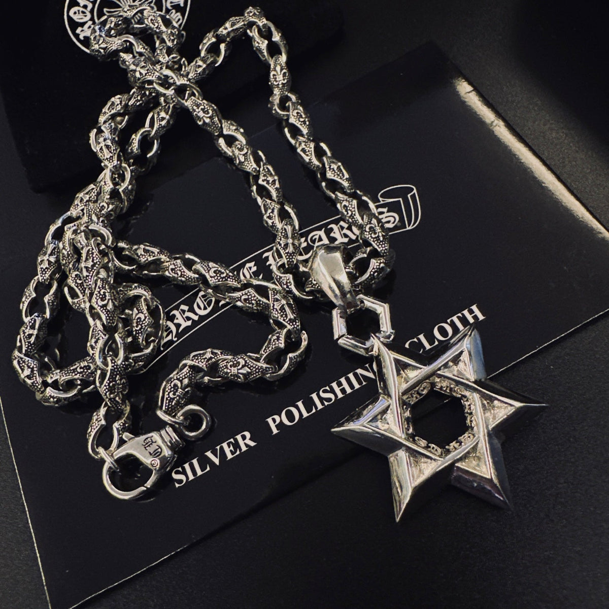 Martin Graham pendant necklace in polished metal-tone – side detail