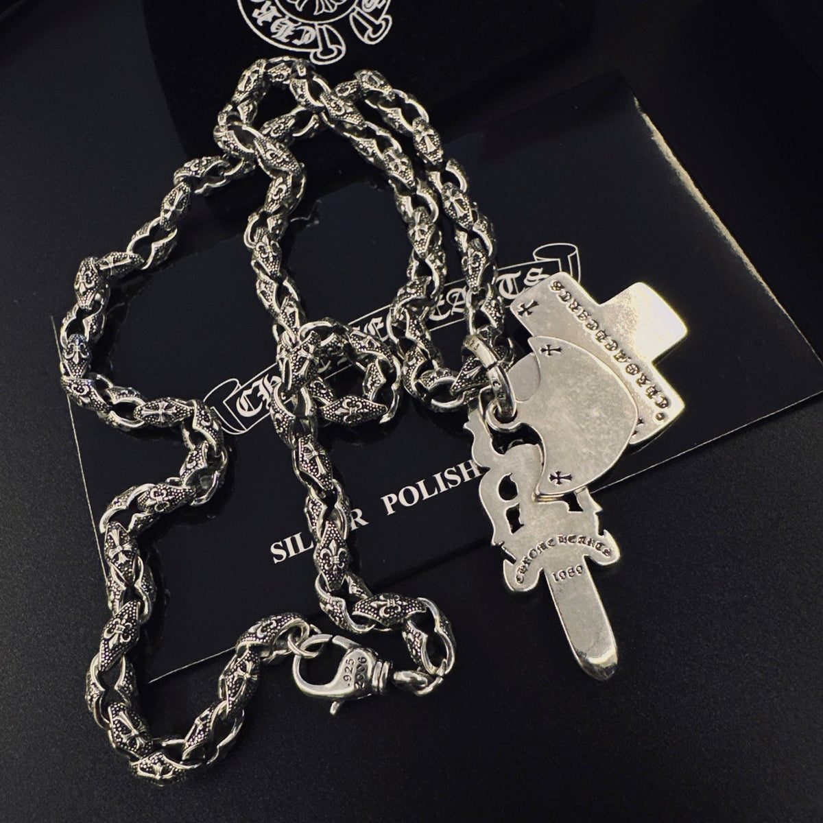 Martin Graham pendant necklace in polished metal-tone – close-up detail