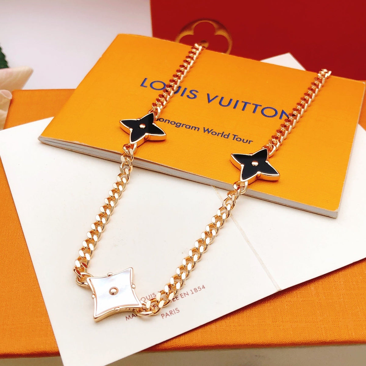 Martin Graham pendant necklace in polished metal-tone – side detail