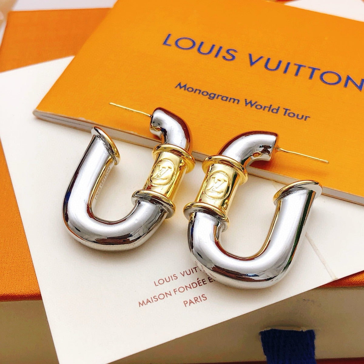 Martin Graham earrings in polished metal-tone – front product view