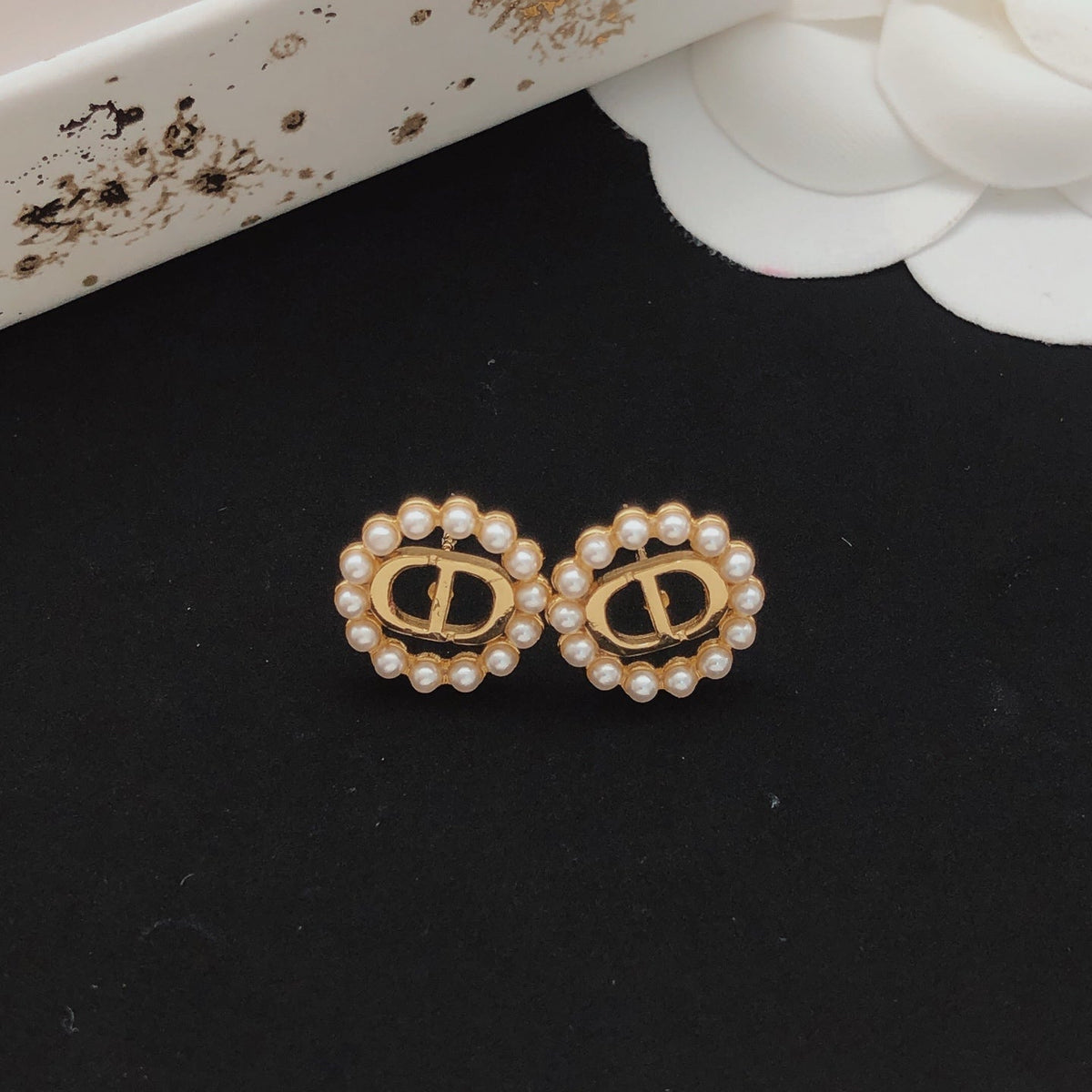 Martin Graham stud earrings in polished metal-tone – front view