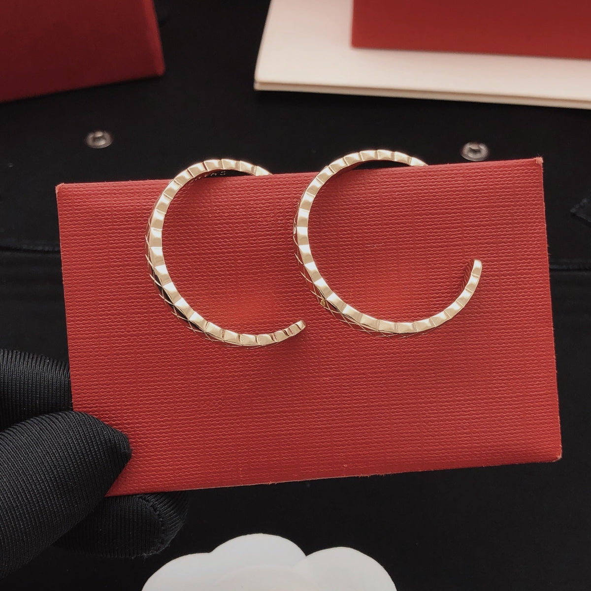 Martin Graham earrings in polished metal-tone – close-up detail