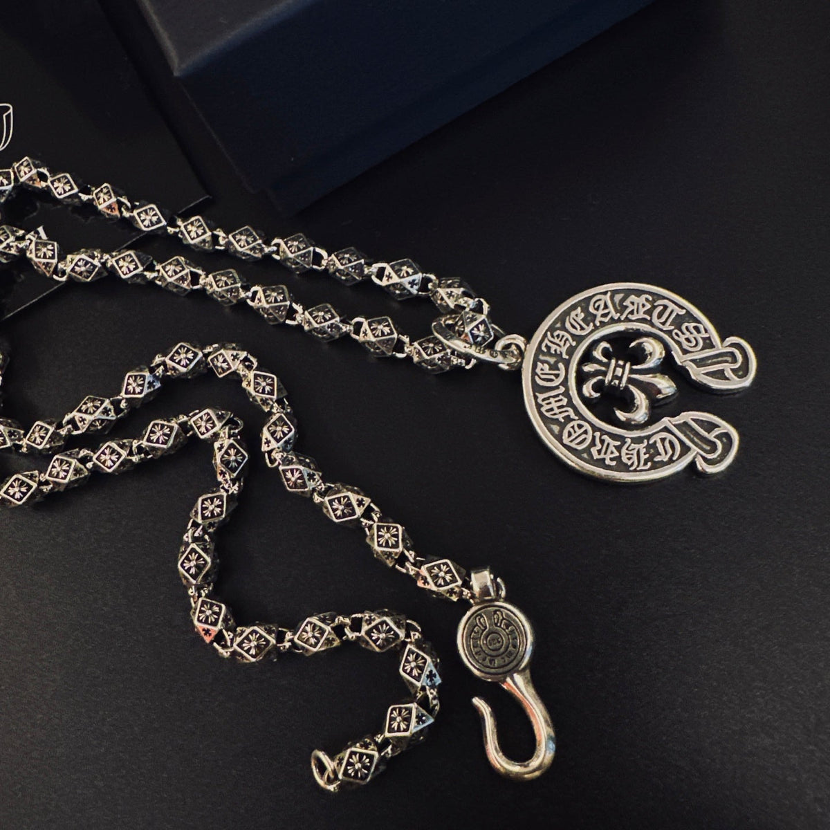 Martin Graham pendant necklace in polished metal-tone – close-up detail