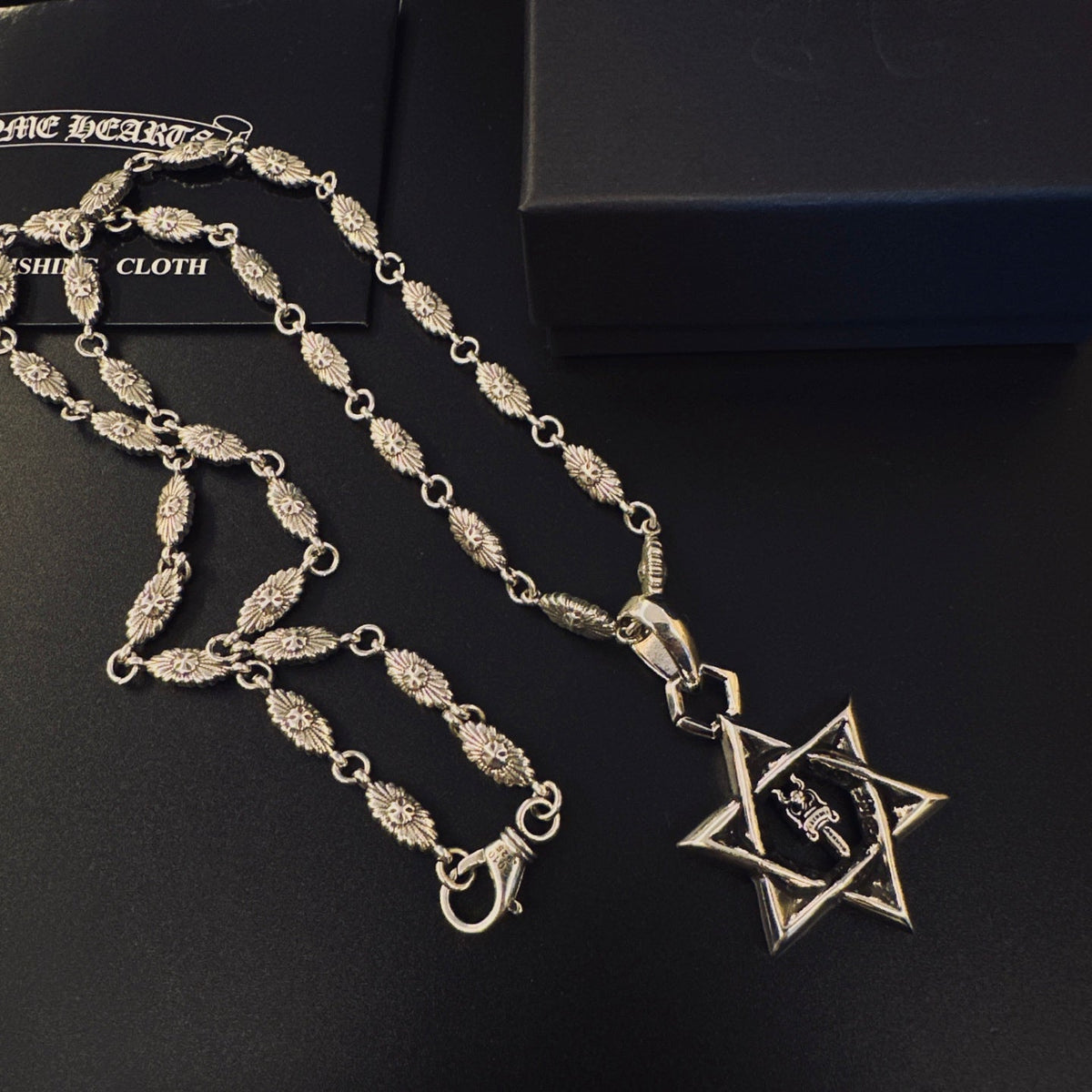 Martin Graham pendant necklace in polished metal-tone – close-up detail