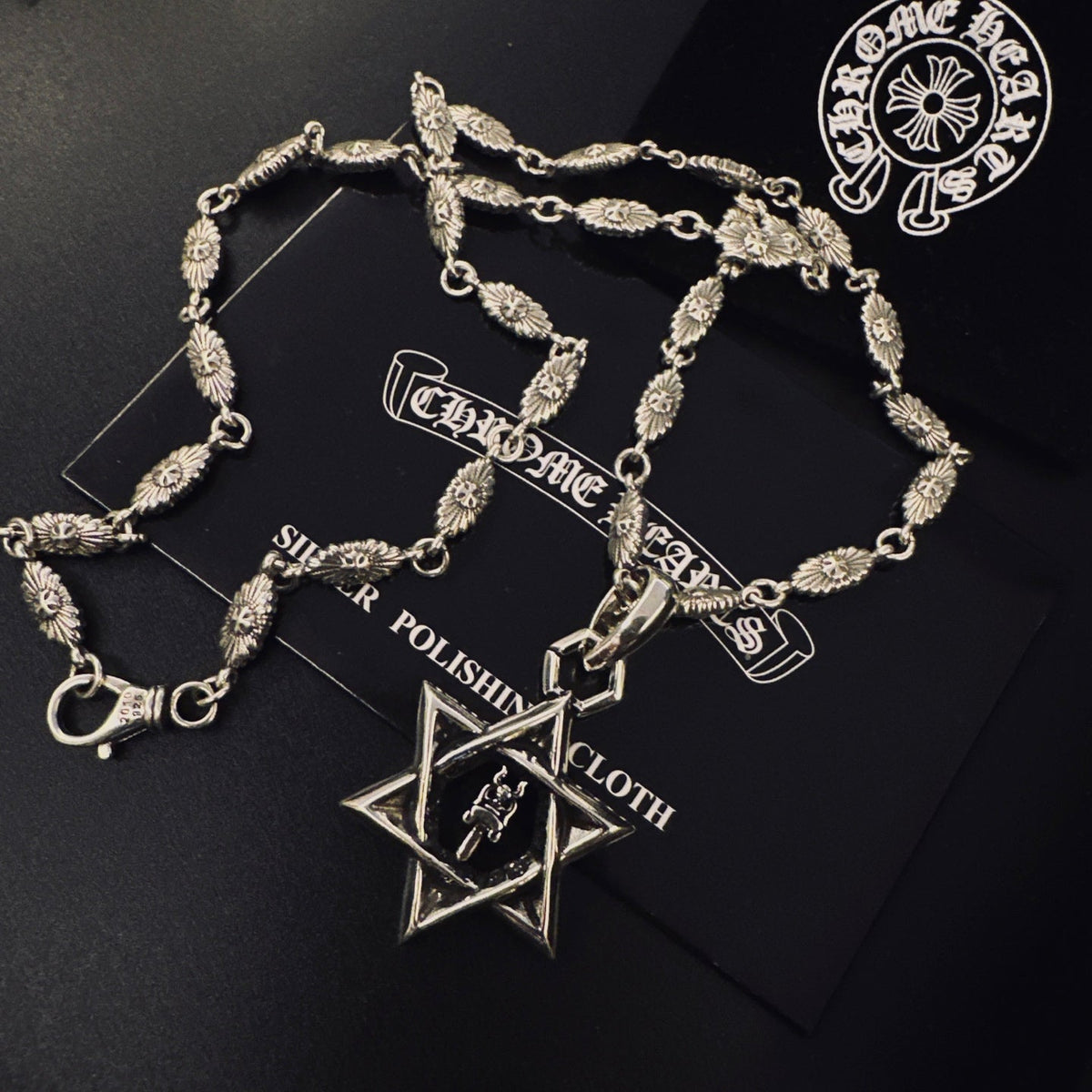 Martin Graham pendant necklace in polished metal-tone – side detail