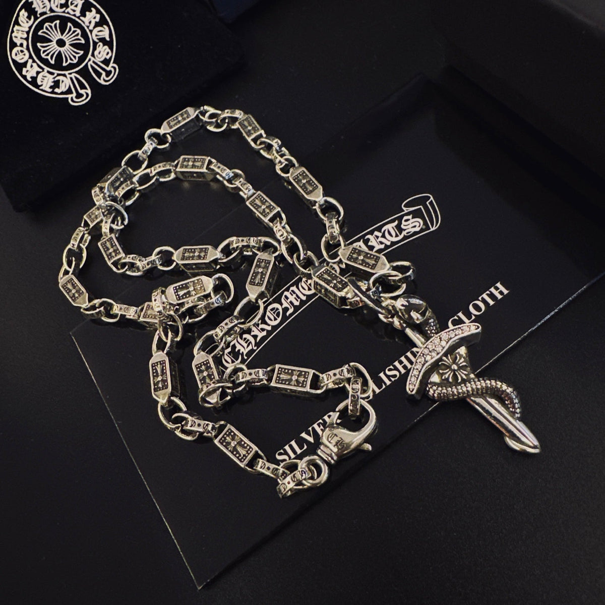 Martin Graham pendant necklace in polished metal-tone – detail view