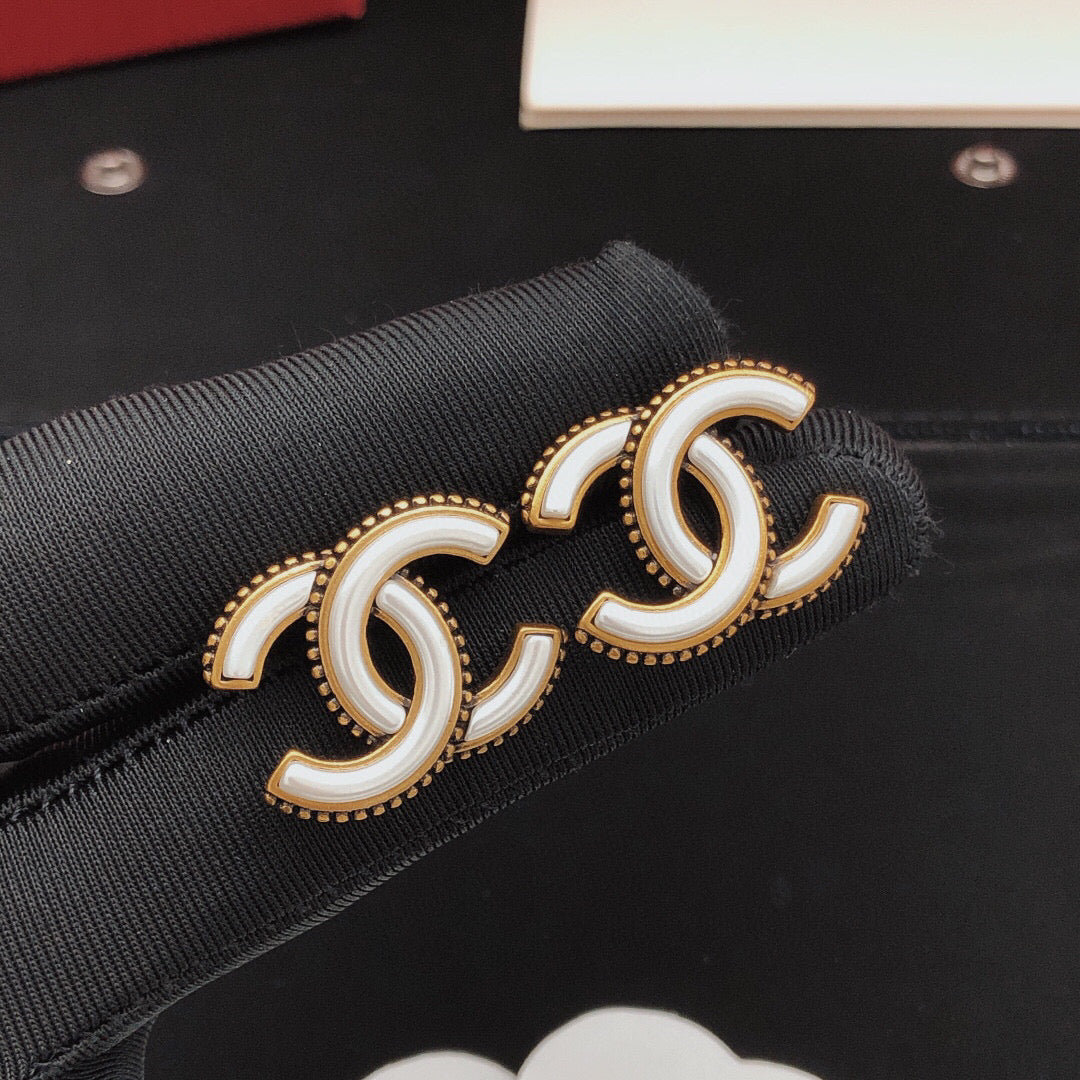 Martin Graham Double-C stud earrings in gold-tone – styled product view