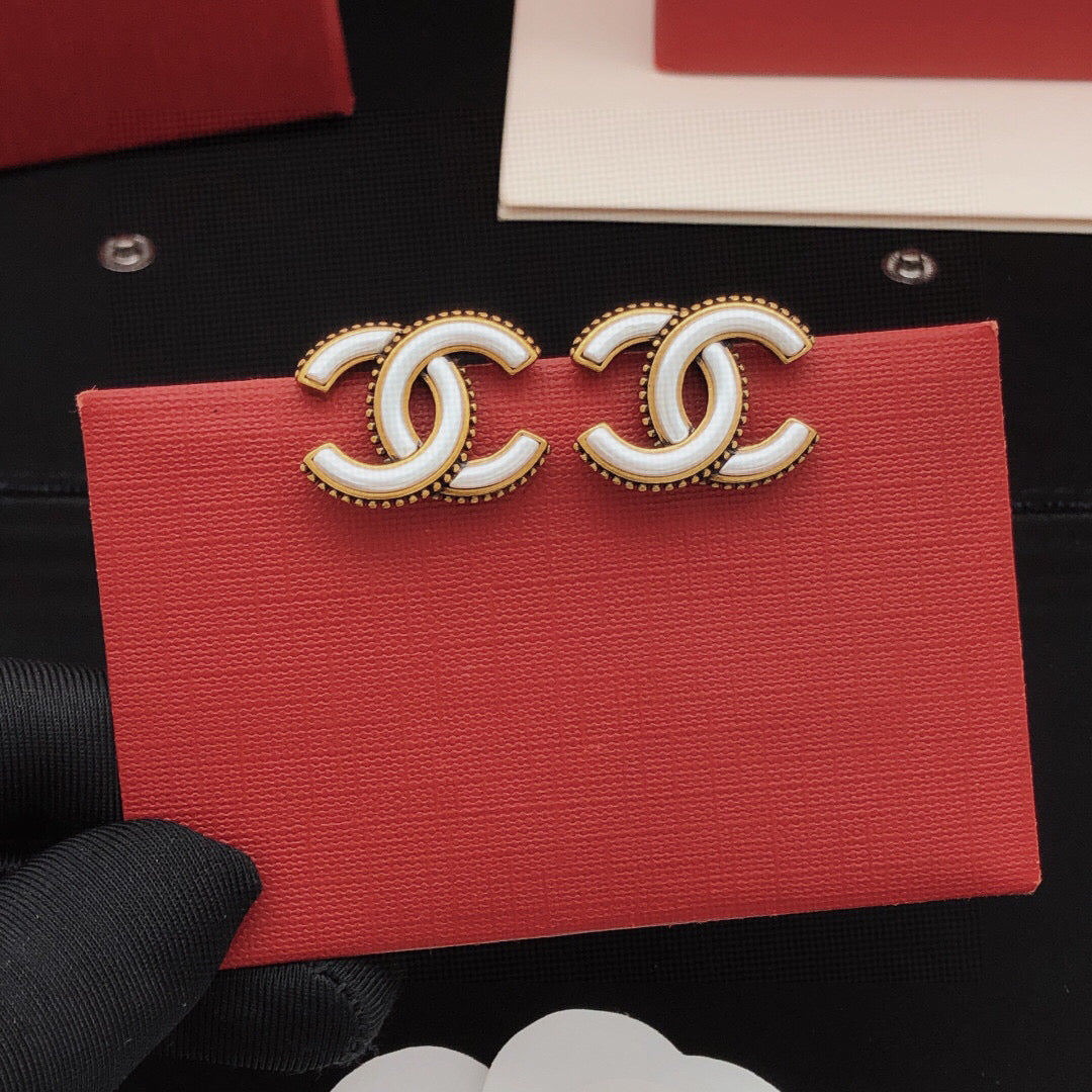 Martin Graham Double-C stud earrings in gold-tone – front product view