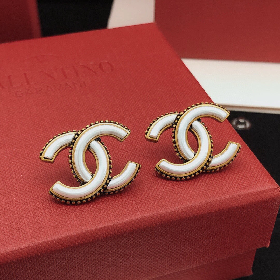 Martin Graham Double-C stud earrings in gold-tone – detail view