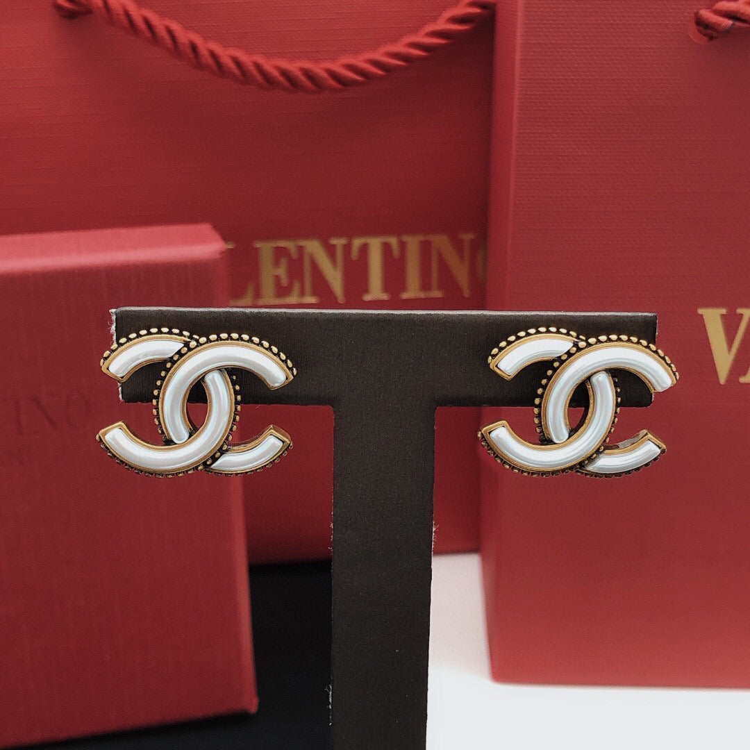Martin Graham Double-C stud earrings in gold-tone – detail view