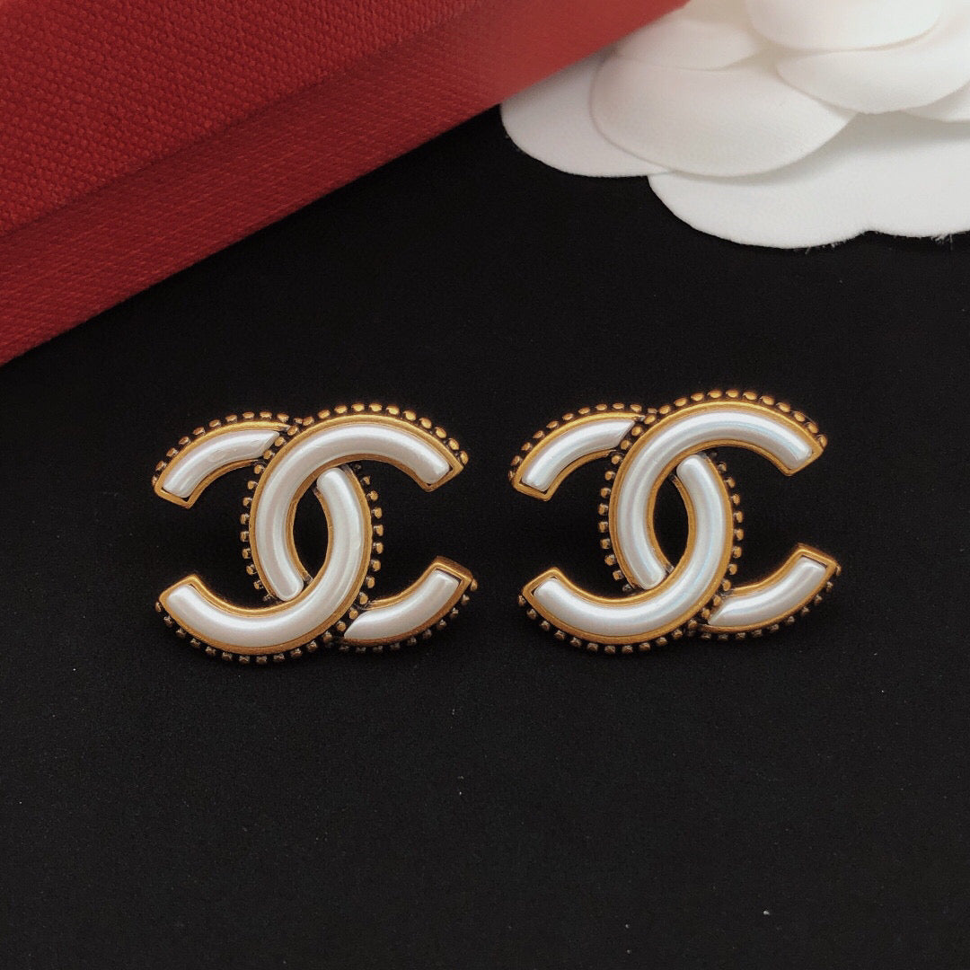 Martin Graham Double-C stud earrings in gold-tone – close-up detail