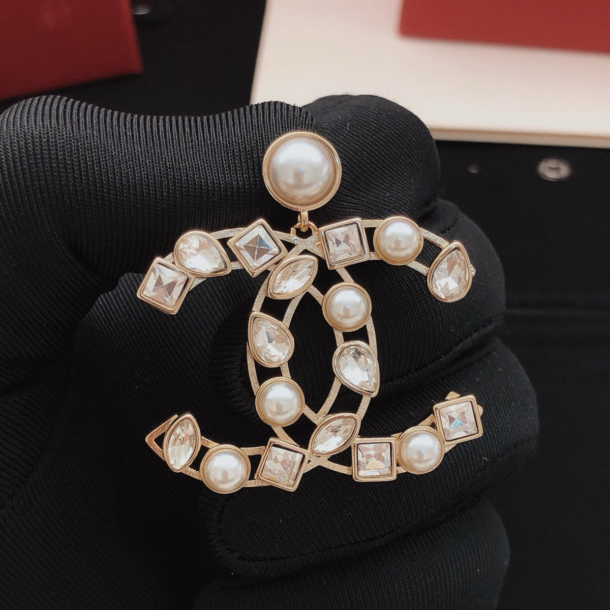 Martin Graham stud earrings in polished metal-tone – front product view
