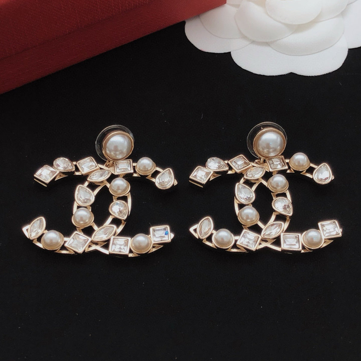 Martin Graham stud earrings in polished metal-tone – front product view