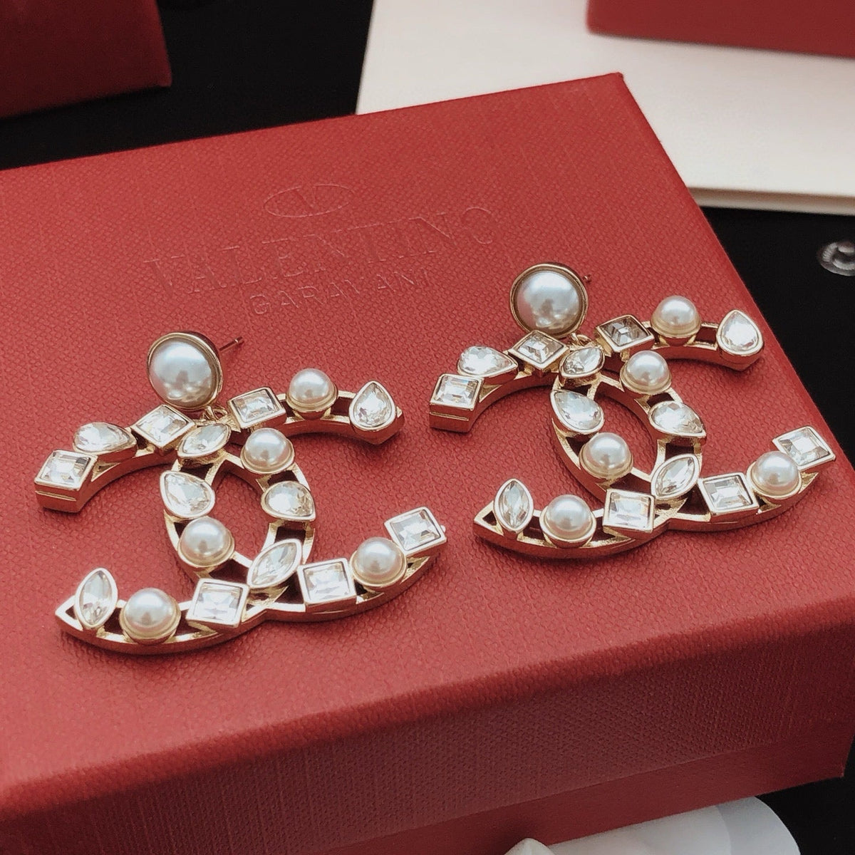 Martin Graham stud earrings in polished metal-tone – close-up detail