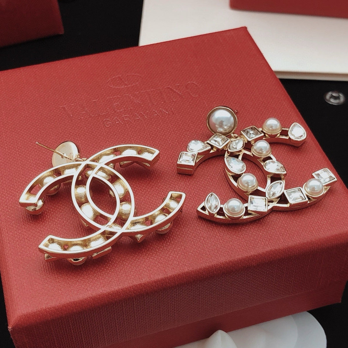 Martin Graham stud earrings in polished metal-tone – styled product view