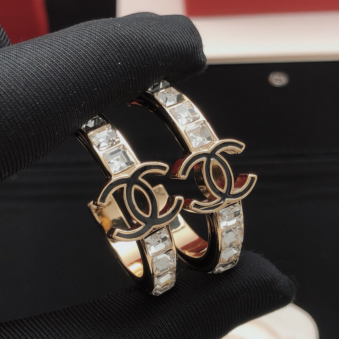 Martin Graham earrings in polished metal-tone – close-up detail