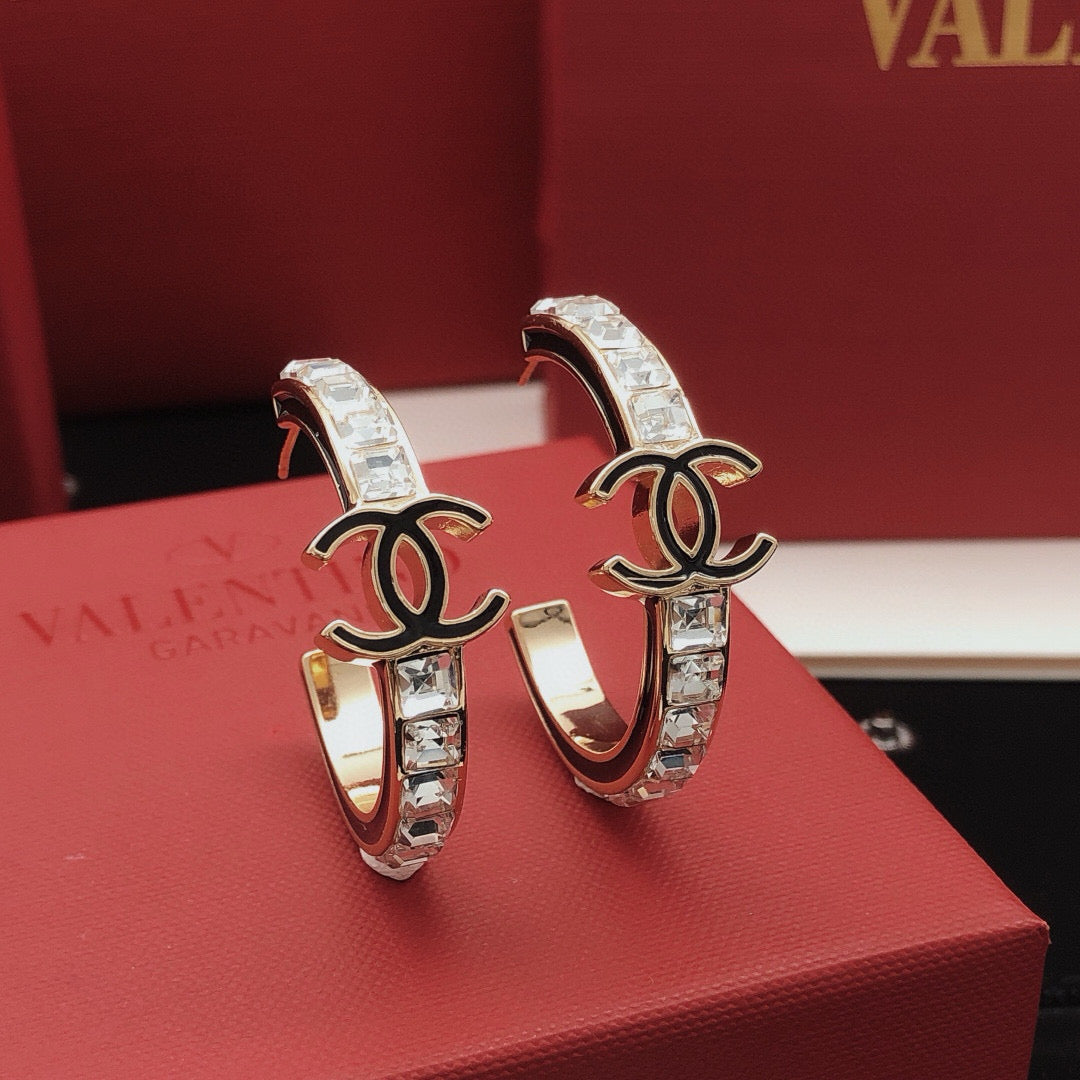Martin Graham earrings in polished metal-tone – front product view