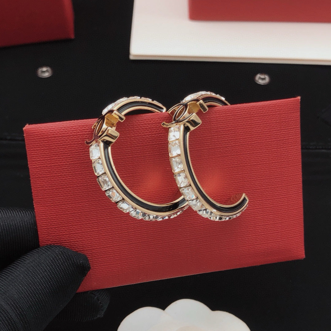 Martin Graham earrings in polished metal-tone – front product view
