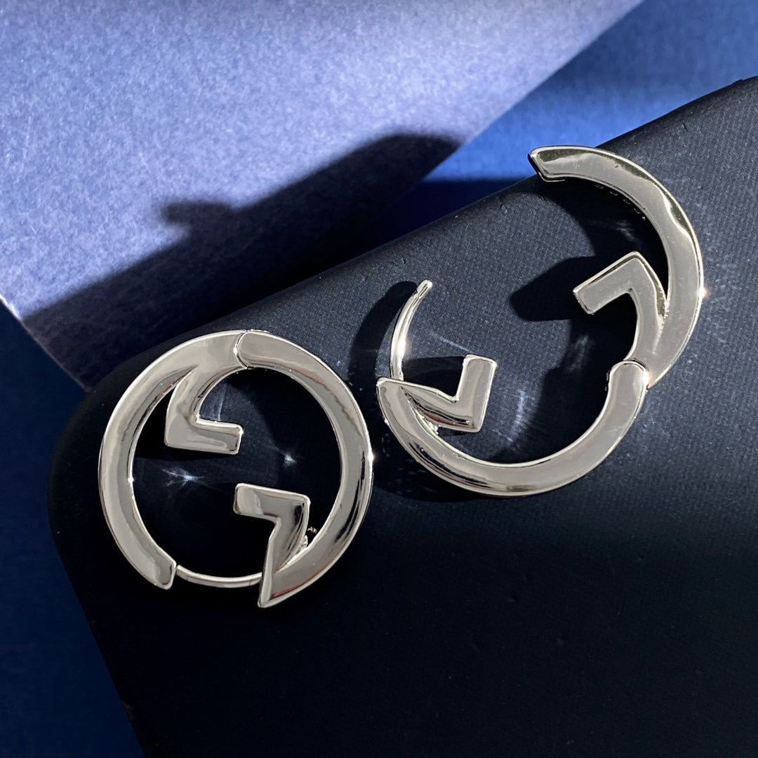 Martin Graham earrings in polished metal-tone – front product view
