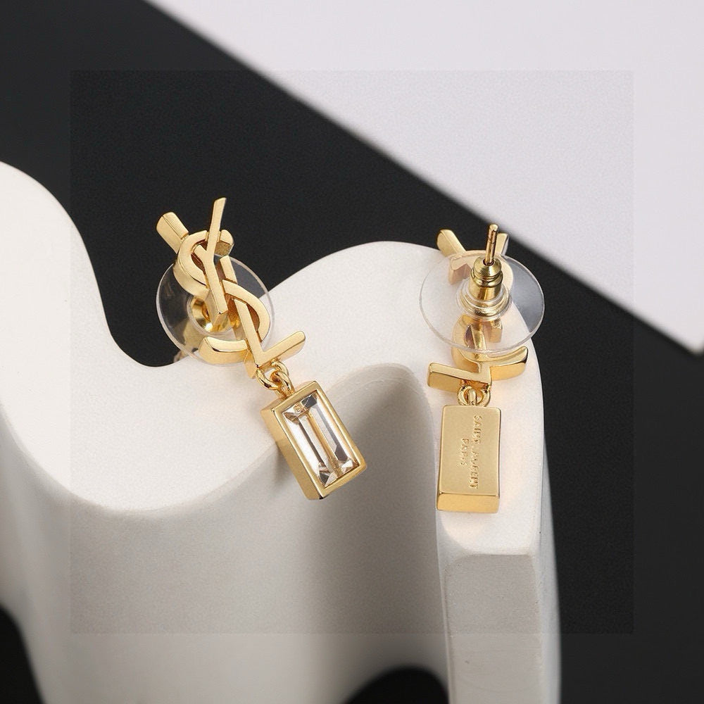 Martin Graham stud earrings in polished metal-tone – close-up detail