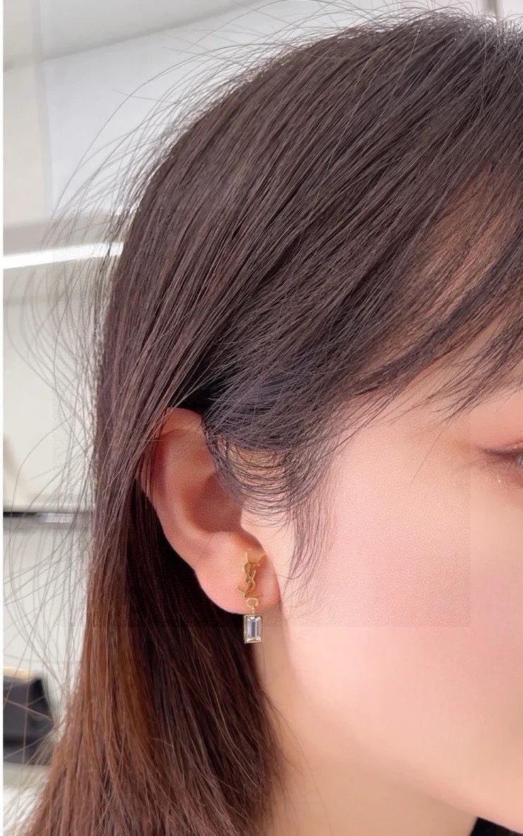 Martin Graham stud earrings in polished metal-tone – side detail