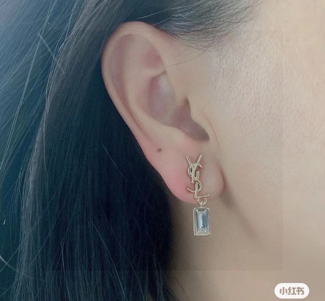 Martin Graham stud earrings in polished metal-tone – styled product view