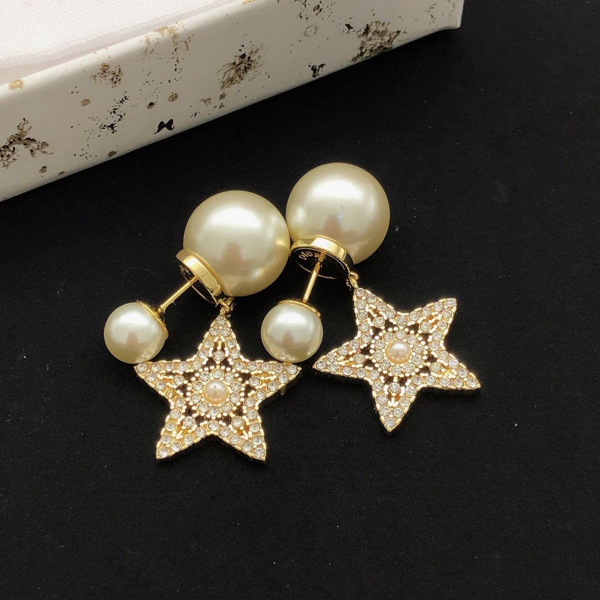 Martin Graham stud earrings in polished metal-tone – side detail