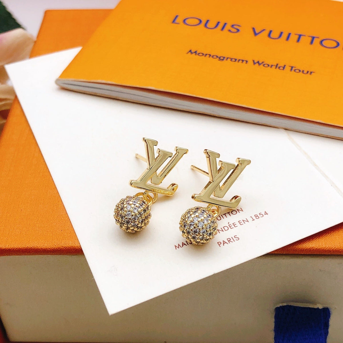 Martin Graham stud earrings in polished metal-tone – front product view