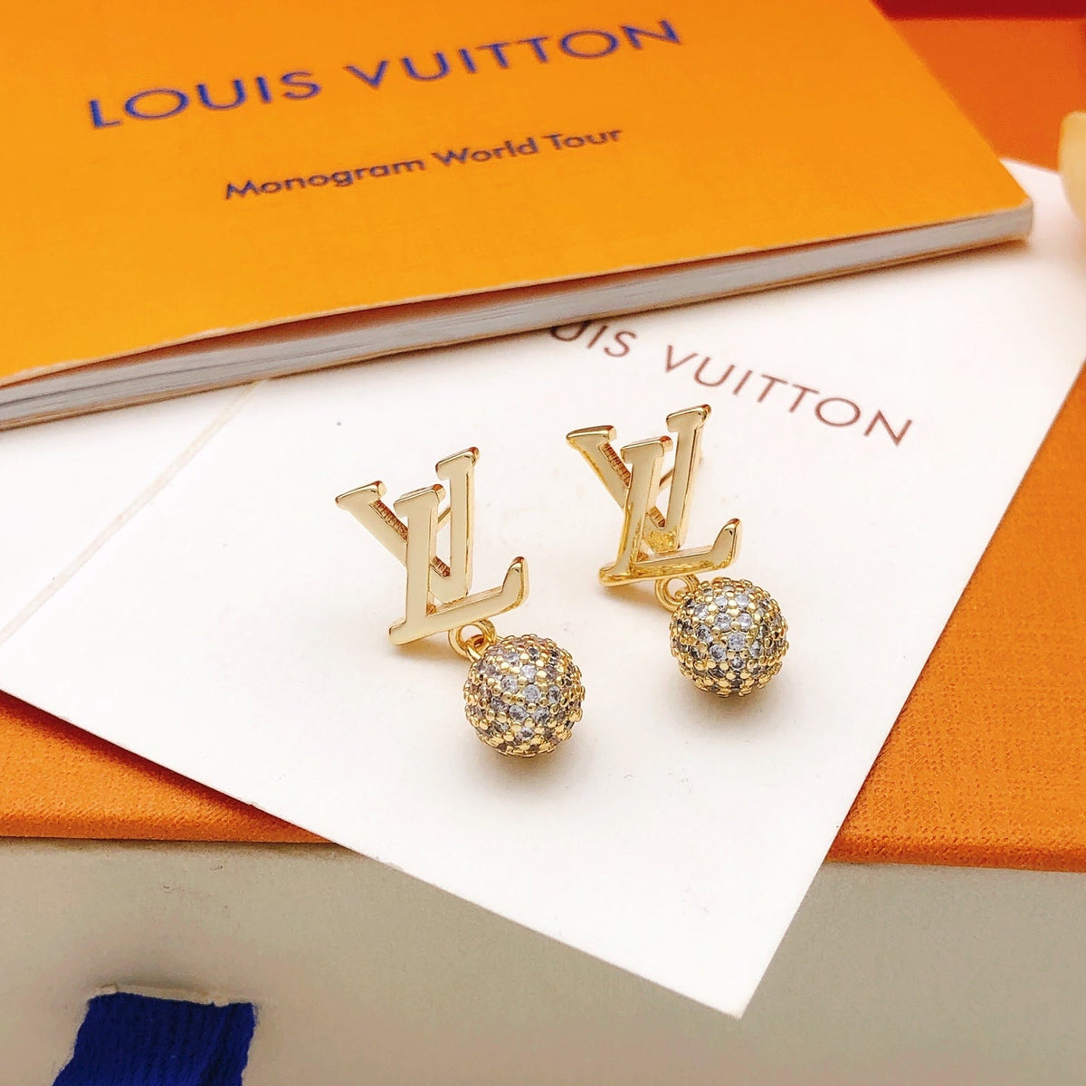 Martin Graham stud earrings in polished metal-tone – detail view
