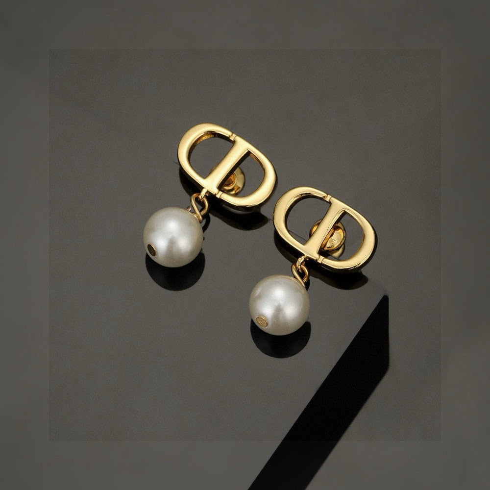 Martin Graham stud earrings in polished metal-tone – main product view