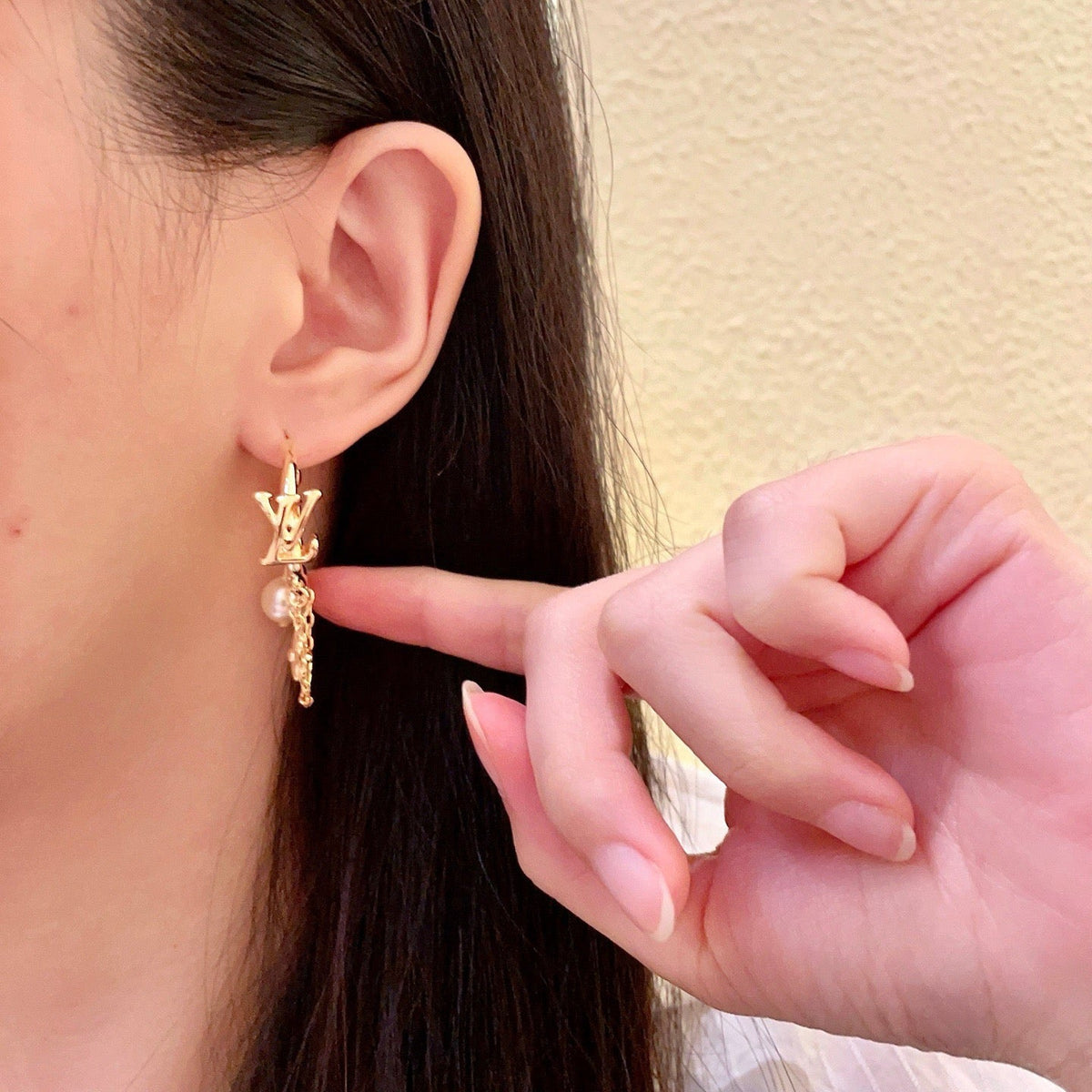 Martin Graham stud earrings in polished metal-tone – detail view