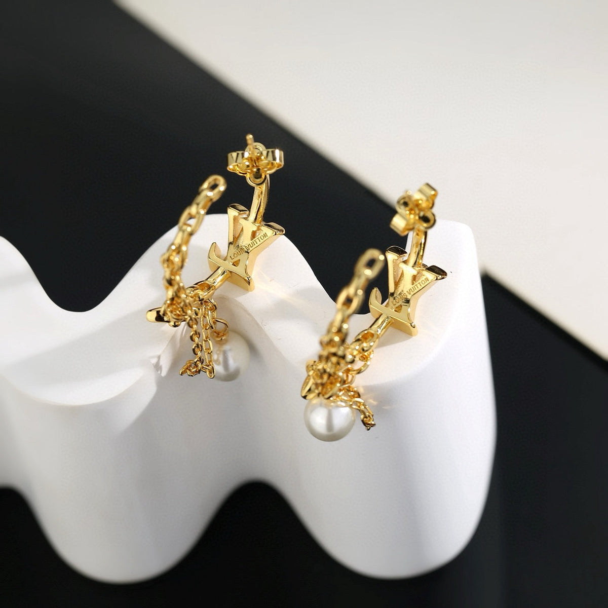 Martin Graham stud earrings in polished metal-tone – close-up detail