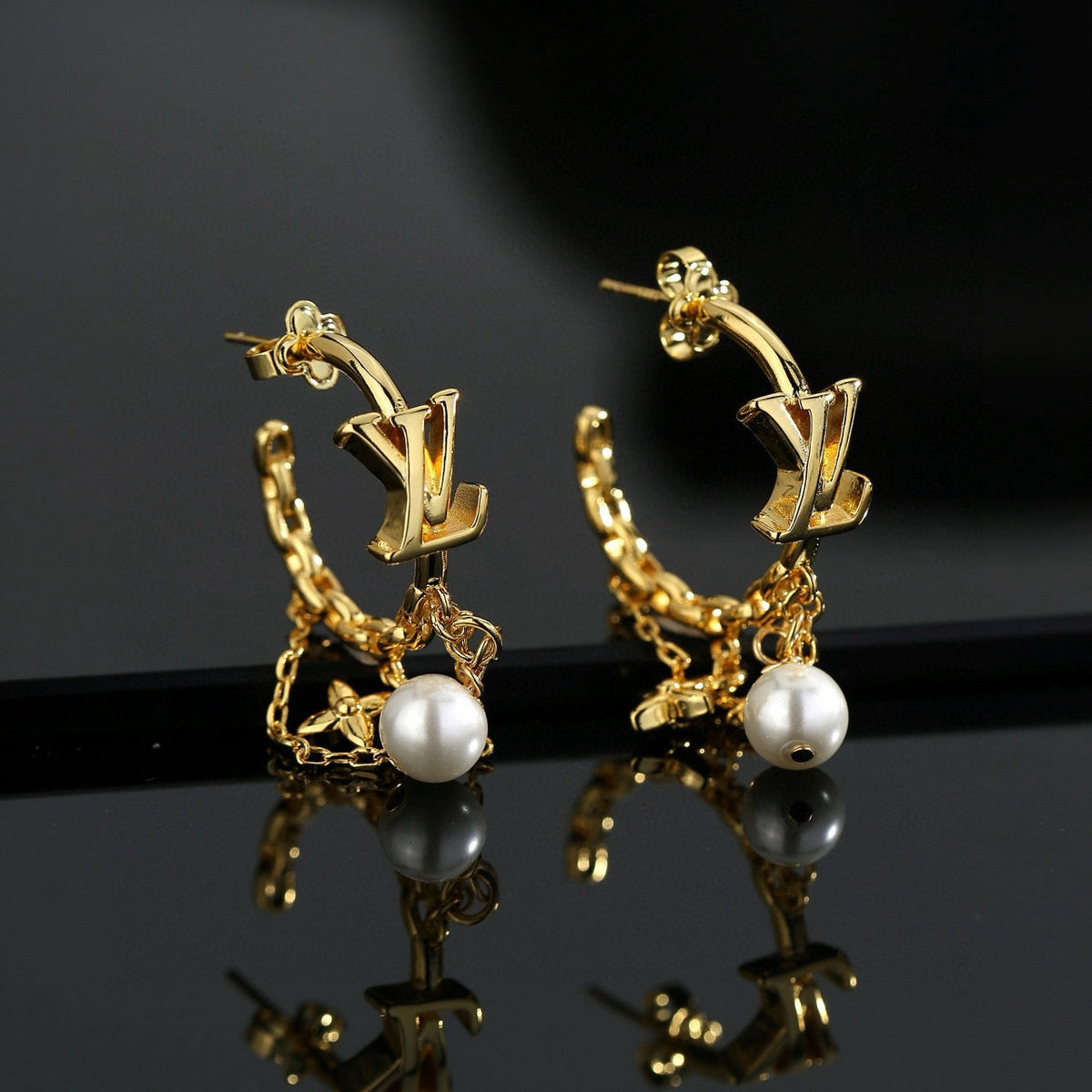 Martin Graham stud earrings in polished metal-tone – main product view