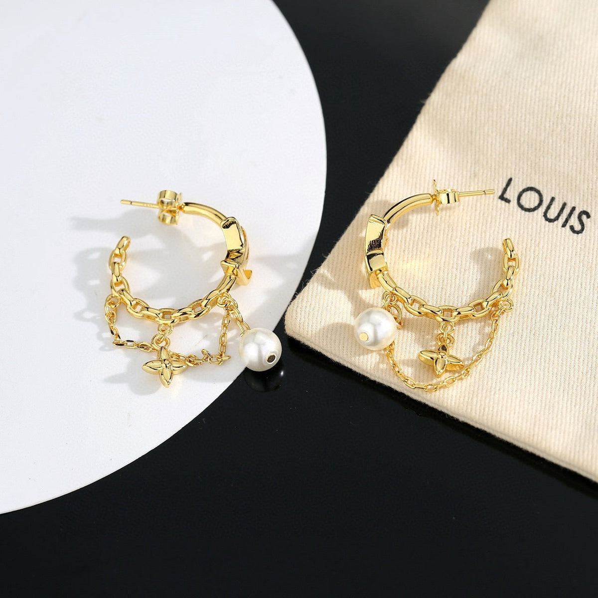 Martin Graham stud earrings in polished metal-tone – front product view