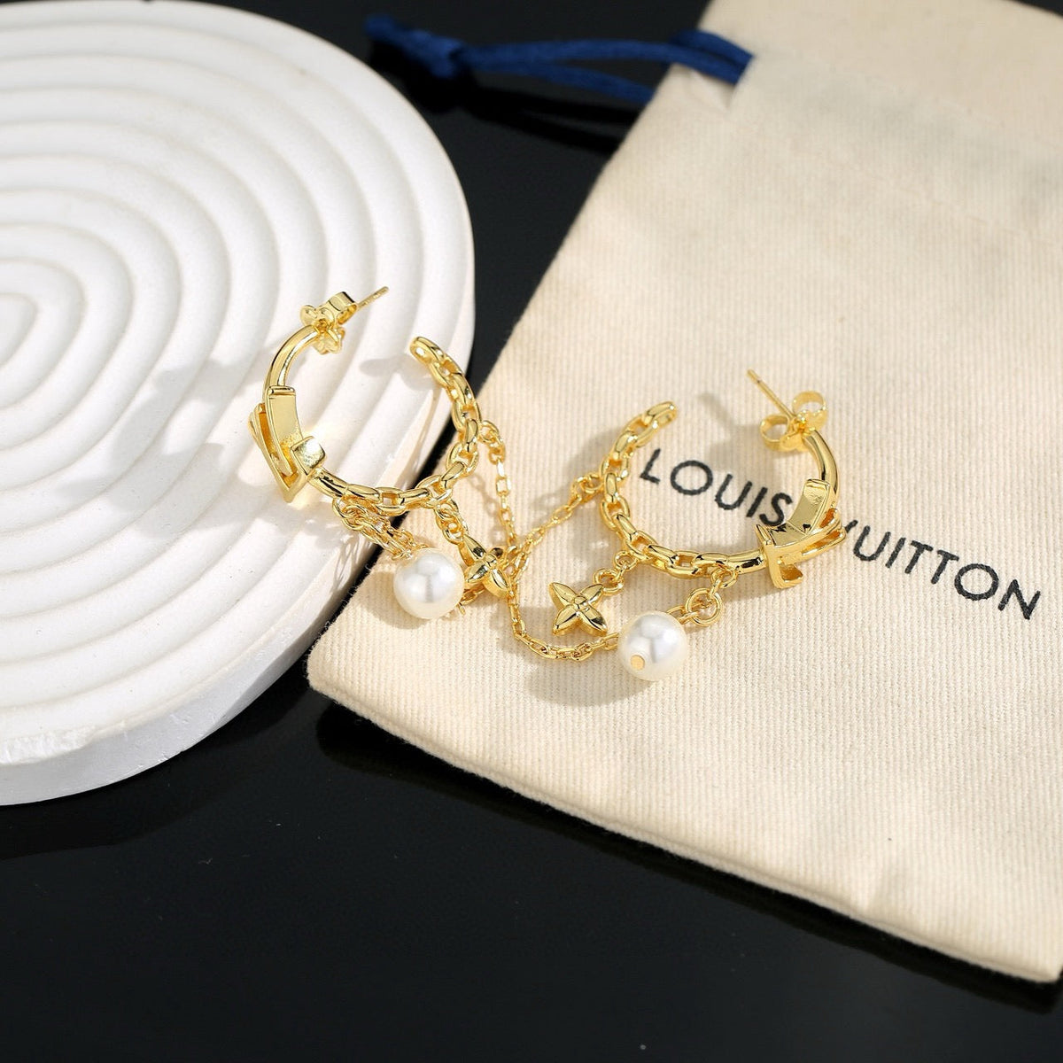 Martin Graham stud earrings in polished metal-tone – styled product view