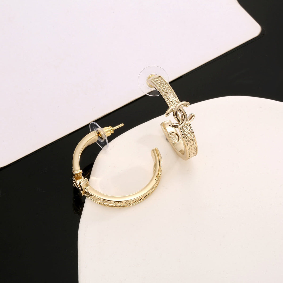 Martin Graham stud earrings in polished metal-tone – front product view