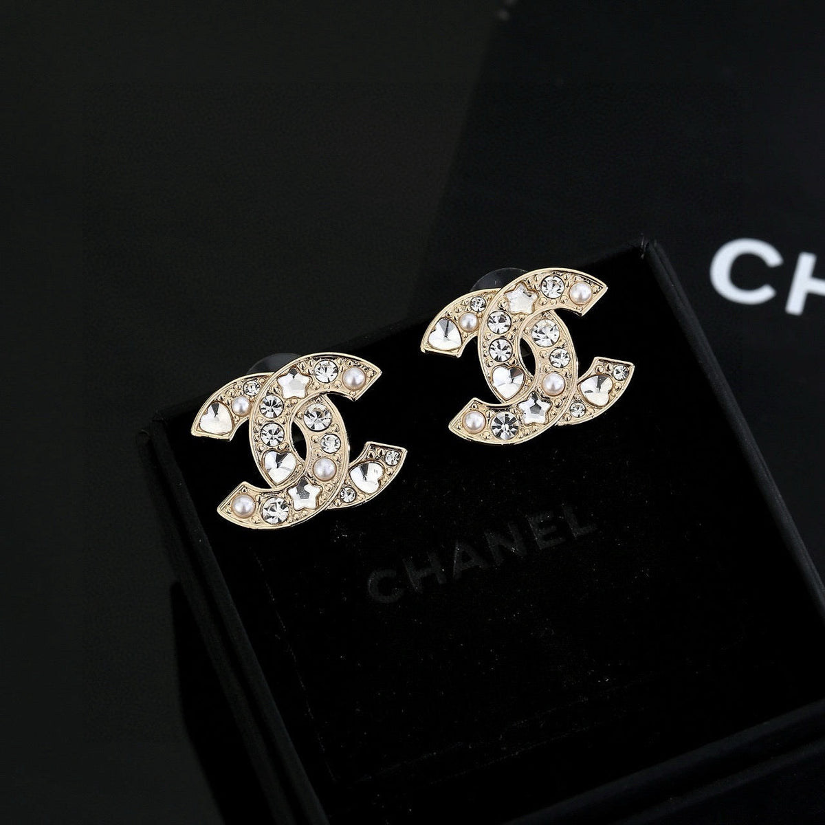 Martin Graham stud earrings in polished metal-tone – front product view