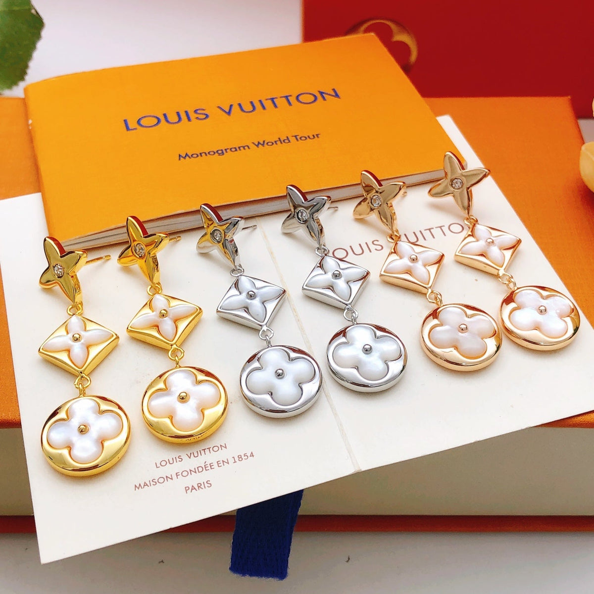 Martin Graham stud earrings in polished metal-tone – close-up detail