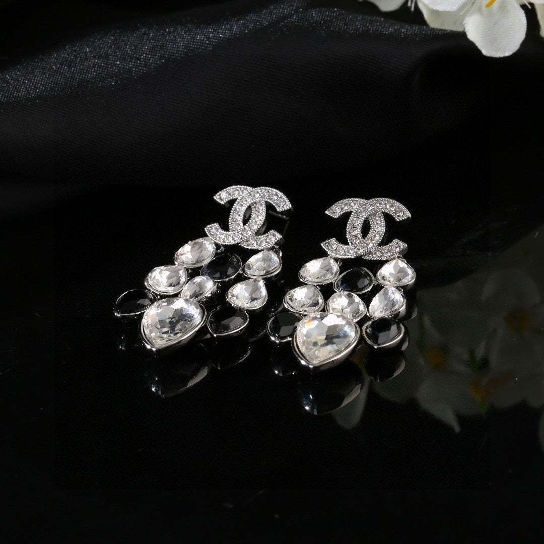 Martin Graham stud earrings in polished metal-tone – styled product view