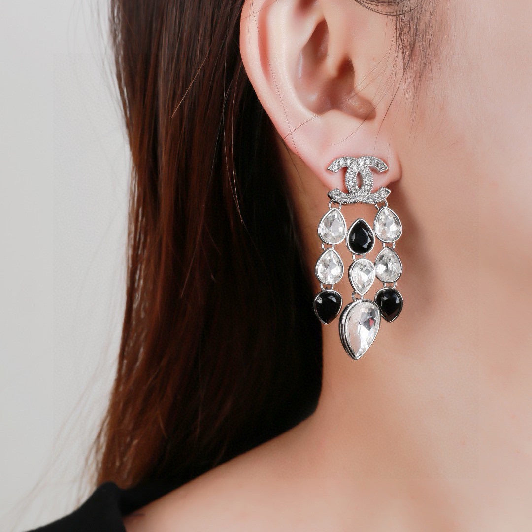 Martin Graham stud earrings in polished metal-tone – front product view