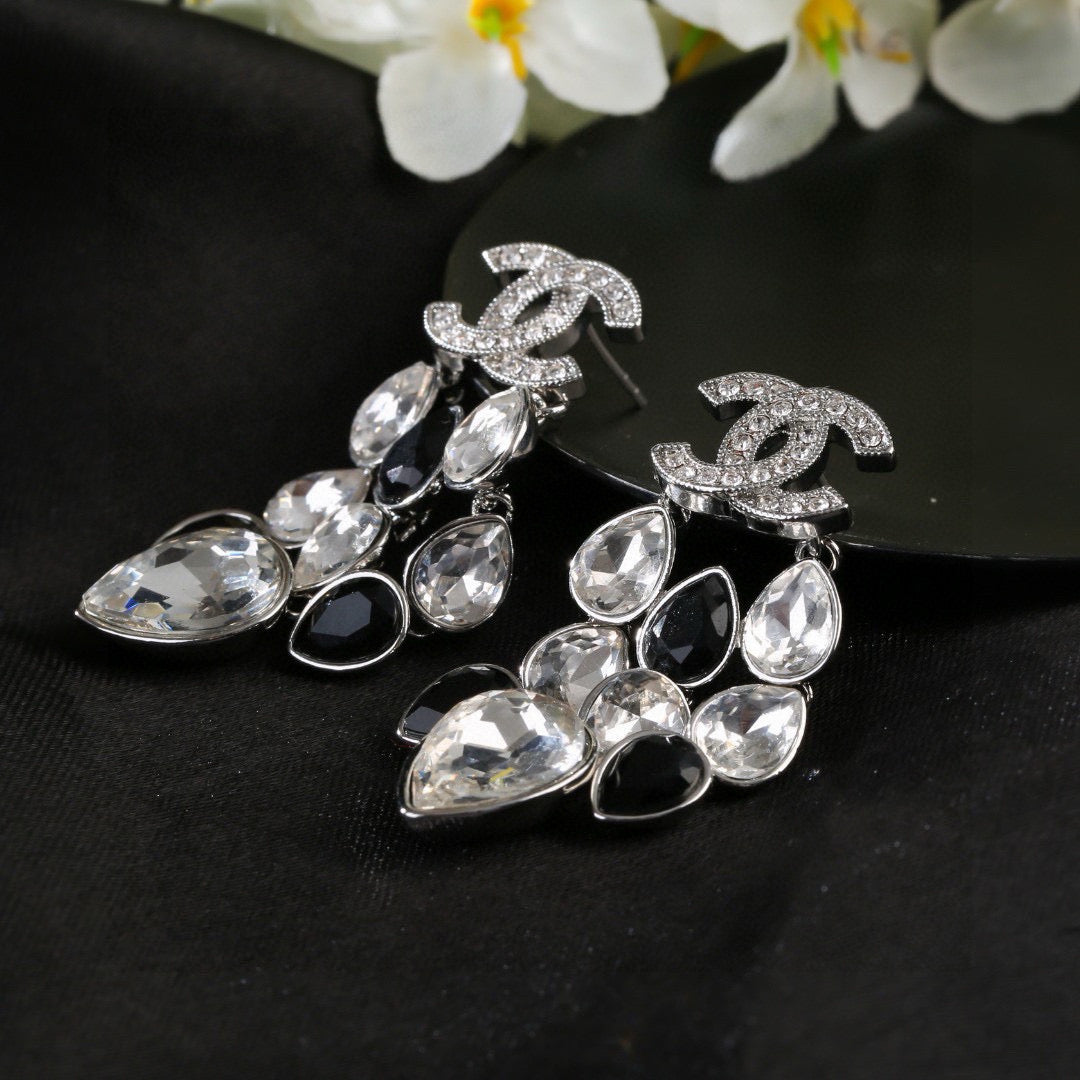 Martin Graham stud earrings in polished metal-tone – detail view