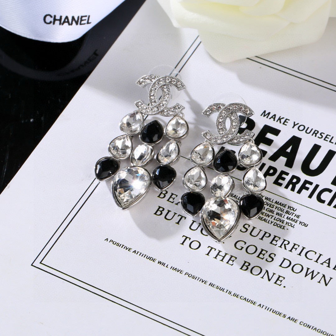Martin Graham stud earrings in polished metal-tone – front product view