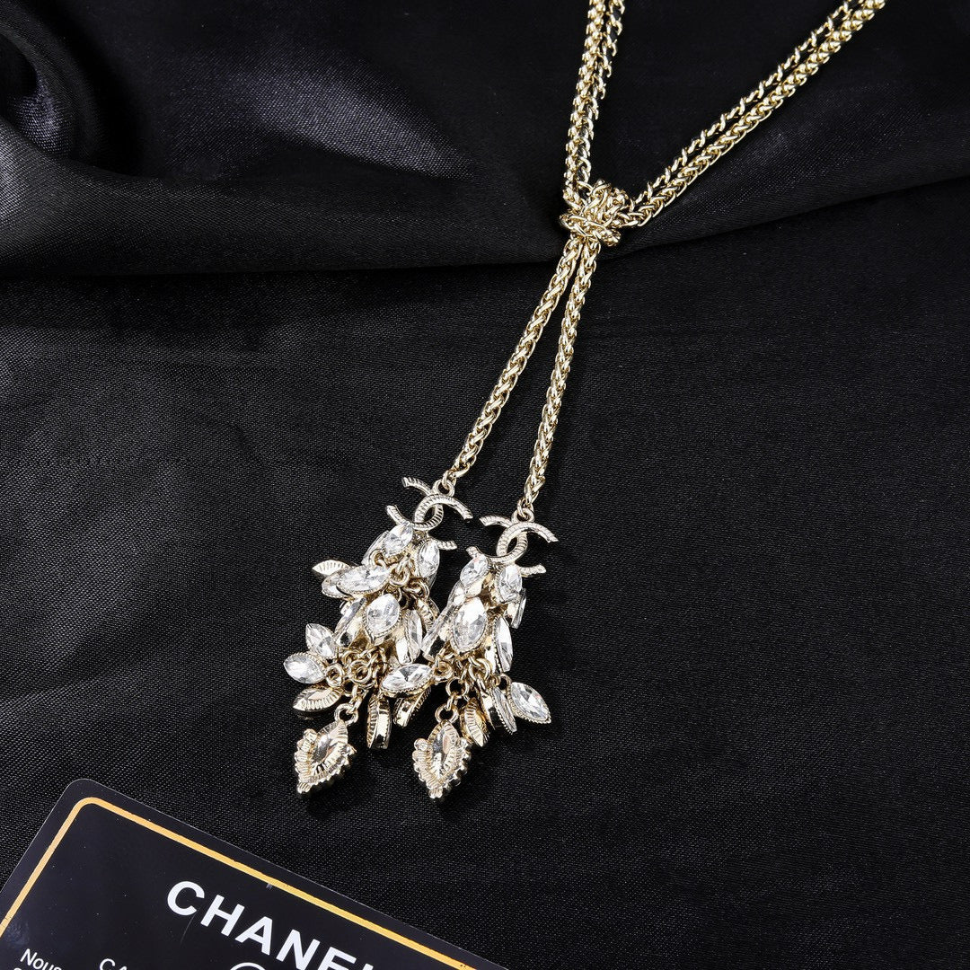 Martin Graham pendant necklace in polished metal-tone – close-up detail