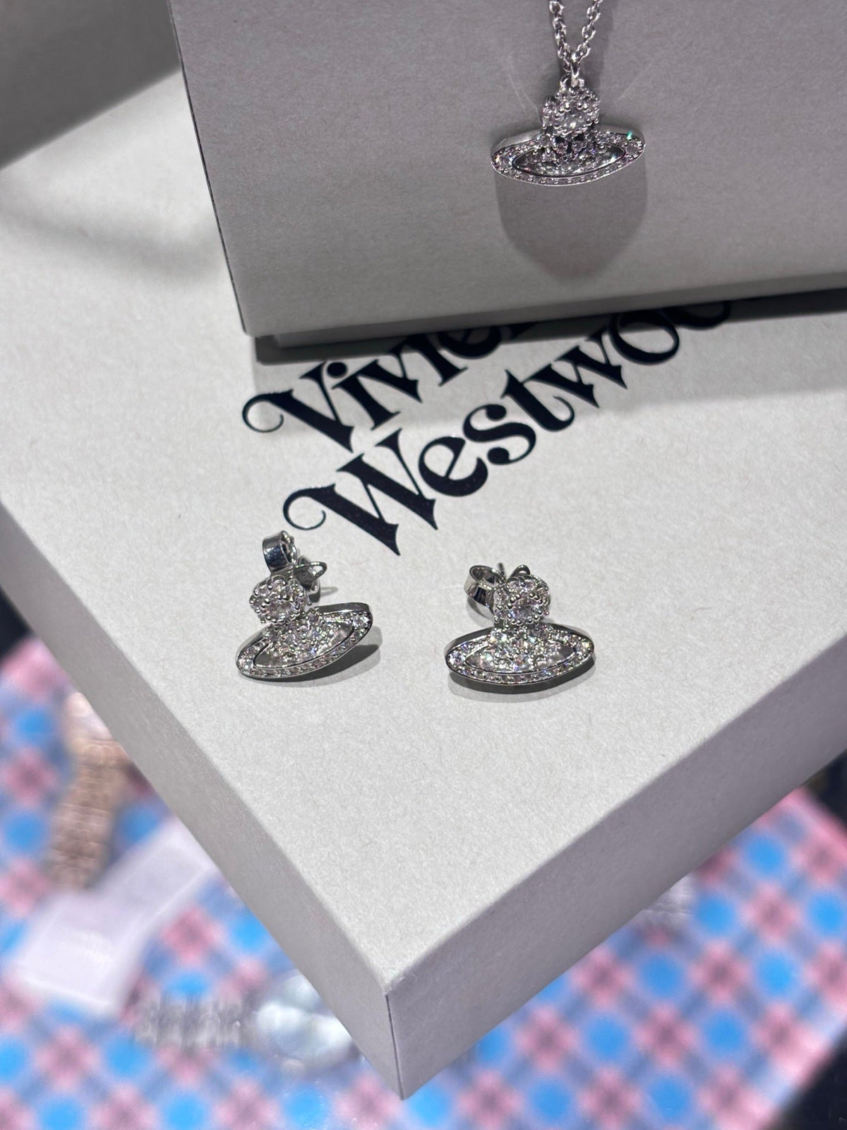 Martin Graham stud earrings in polished metal-tone – detail view