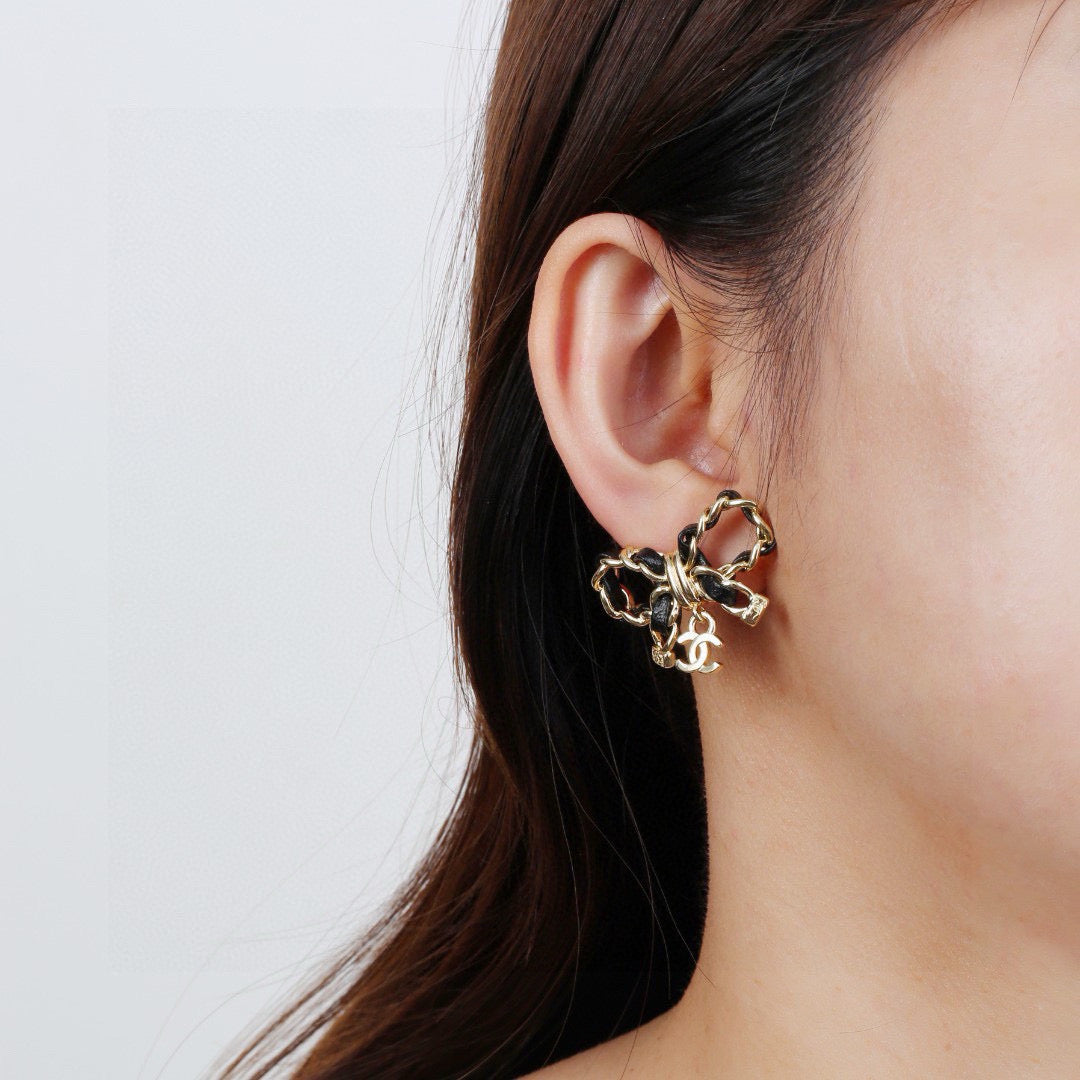 Martin Graham earrings in polished metal-tone – front product view
