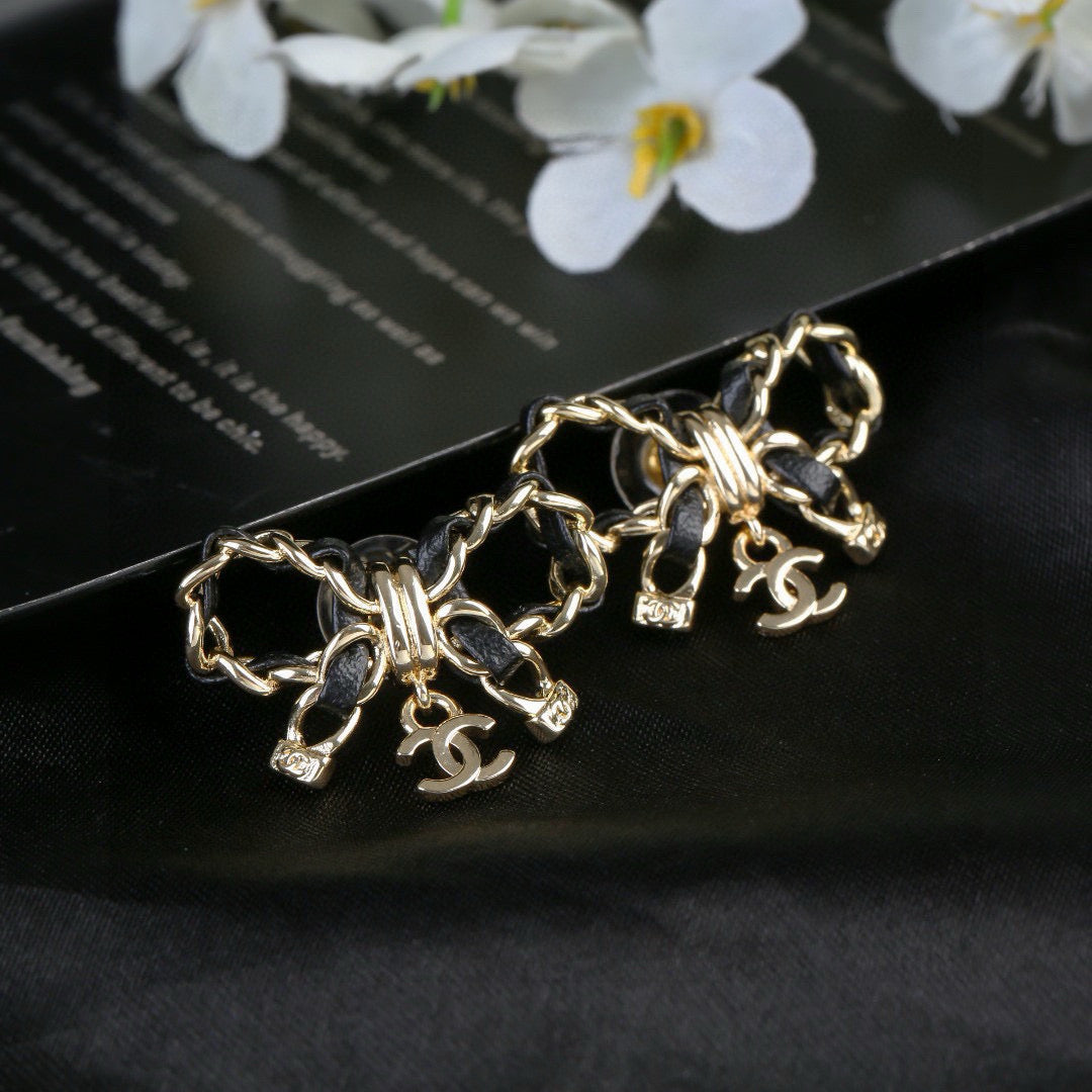 Martin Graham earrings in polished metal-tone – close-up detail