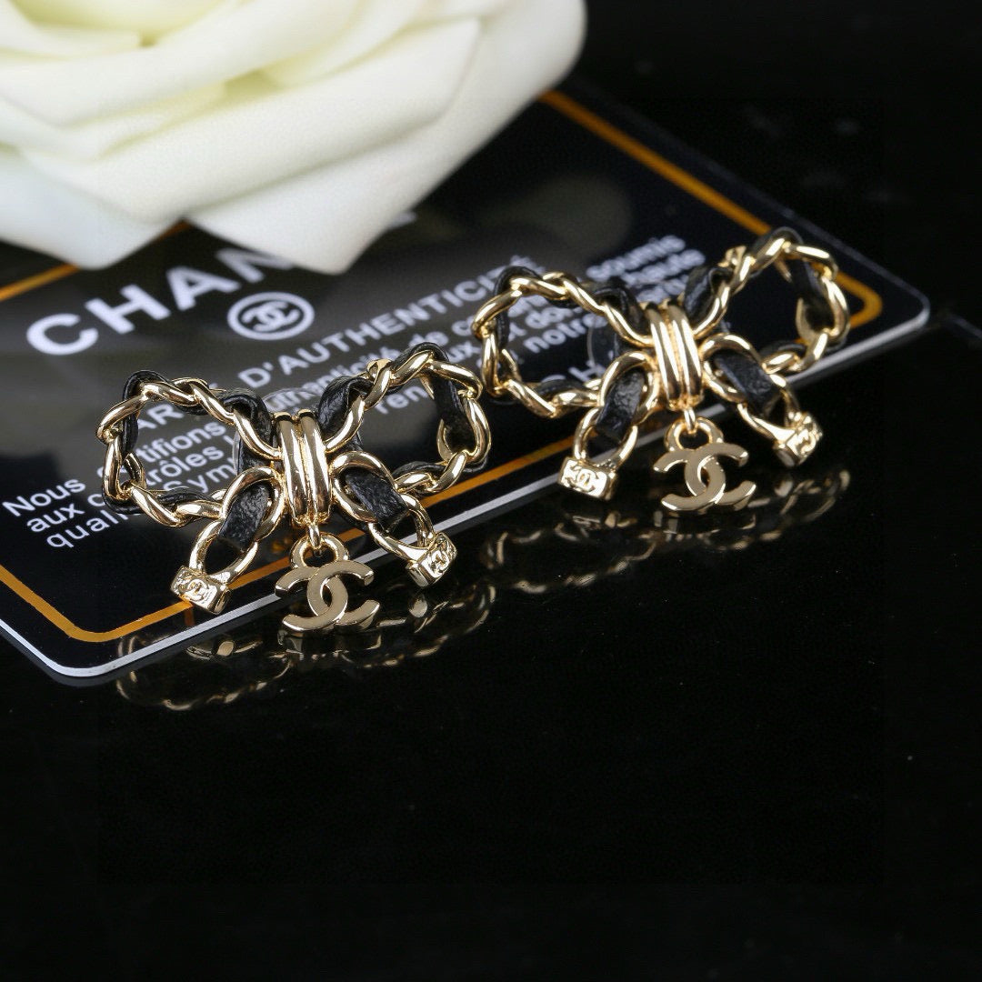 Martin Graham earrings in polished metal-tone – front product view