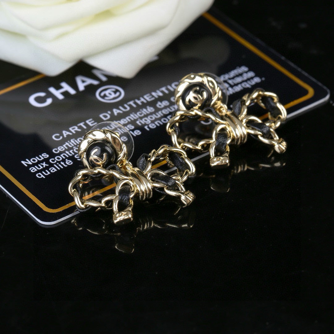 Martin Graham earrings in polished metal-tone – front product view