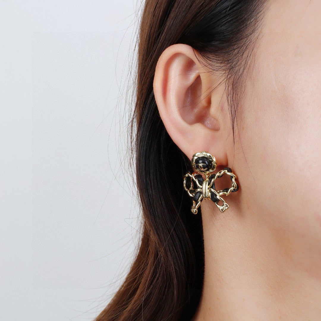 Martin Graham earrings in polished metal-tone – front product view
